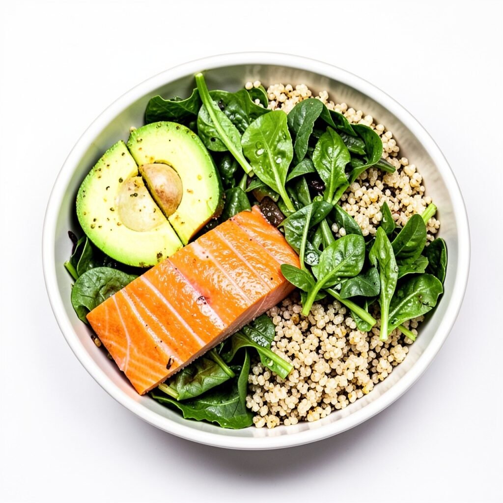 Balanced model diet plate with greens, salmon and avocado